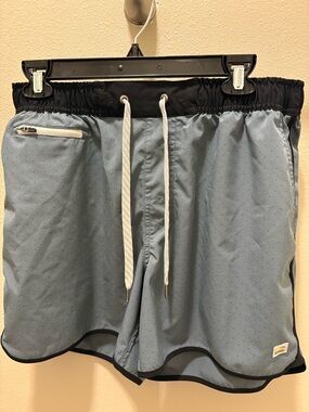 Light Blue Men’s Vuori Athletic Shorts with Black Trim